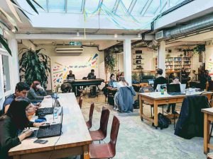 People coworking for Husk Creative and Coffee, a charity run free workspace